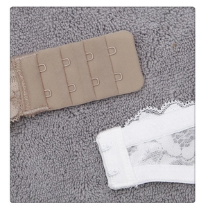 Detail view of the four-row adjustable back closure with delicate lace and smooth fabric
