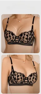 Detailed view of black leopard lace bra with eyelash trim and hollow cross strap design