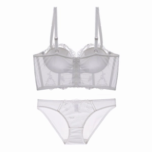Detailed flat lay of a white floral lace longline bra set with sheer mesh embroidery