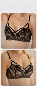 Detailed close-up of embroidered lace bra with underwire support and cross-strap accents