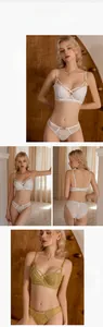 Detail view of lace lingerie set showing white and green colors with strap cross design