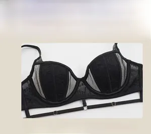 Close-up of black floral lace bra featuring sheer mesh details and metal ring accents