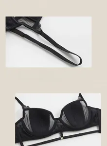 Close-up of elastic straps and black lace mesh cups on a French style wired bra
