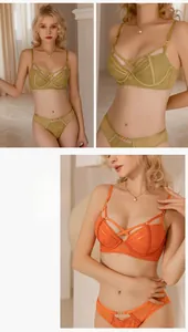 Detailed close-up of lace lingerie set with strappy cage design and metal hardware