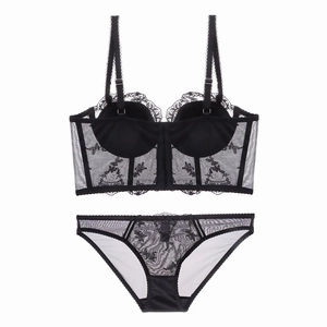 Detail of black French lace embroidery on bustier and matching low-rise brief set