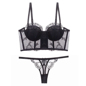Detailed view of black lace lingerie set featuring floral embroidery and mesh texture
