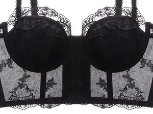Detailed view of black French lace bustier with intricate embroidery and sheer mesh texture