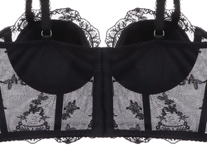 Detail of black French embroidery lace bustier back with hook-and-eye closure system
