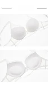 Detailed macro view of white floral lace texture and breathable mesh straps on the bra
