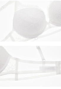 Detail of white lace bra featuring adjustable straps and breathable mesh side wings