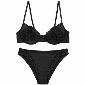 Detailed view of sexy black lace bra and panty set with elegant floral embroidery