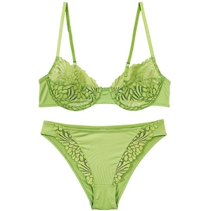 Detail view of apple green lace lingerie set with floral patterns and satin fabric