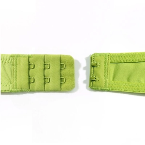 Detail shot of the grass green lace bra featuring a secure double row three-hook back closure