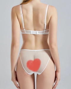 Rear view of white lace lingerie set featuring adjustable straps and mesh panties