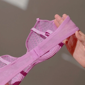 Macro shot of breathable purple honeycomb mesh lace detail on French style lingerie