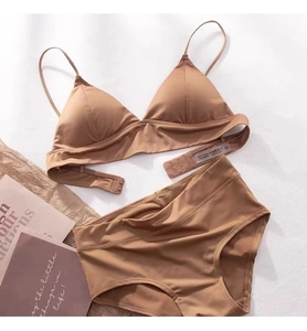 Detail view of caramel triangle cup lingerie set with thin straps on a clean background