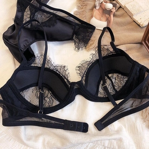 Detailed view of black eyelash lace lingerie set with floral mesh and adjustable straps