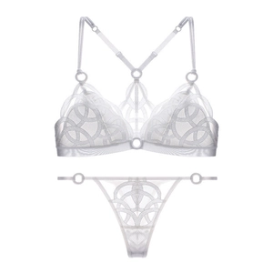 Close-up of white sheer mesh lace lingerie set with concentric circular patterns