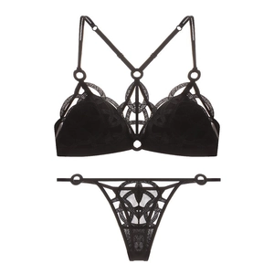 Detail of black mesh embroidery lingerie set with geometric lace and metal ring accents