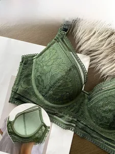 Detail of green lace bra showing front buckle closure and breathable cotton lining