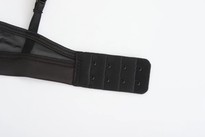 Close-up of black mesh bra back featuring secure two-row four-button hook and eye closure