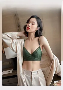 Close-up of deep green vintage floral lace bra with elegant underwire and slim straps