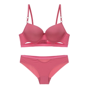 Detail of rose pink seamless bra set with hollow-out design and smooth satin texture
