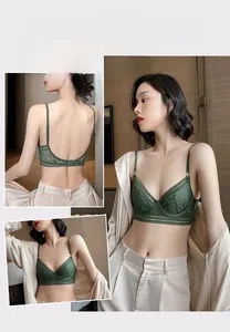 Detail view of dark green floral lace bra with thin straps and low U-back design