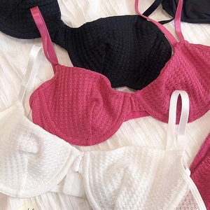 Detail of floral lace texture and underwire support on a stylish deep V bra