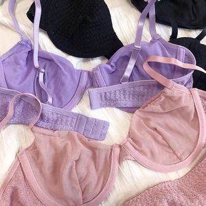 Close-up of sheer mesh lace bras with adjustable straps and multi-row hook closure