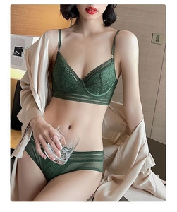 Detail of dark green lace lingerie set with French triangle cup bra and sheer panties