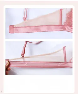 Détail de l'aile latérale du soutien-gorge en dentelle rose avec maille extensible