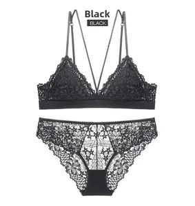 Detailed flat lay of black French lace triangle cup bra set with floral patterns