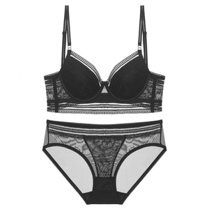French lace lingerie set with black U-back bra and mesh panties on white background