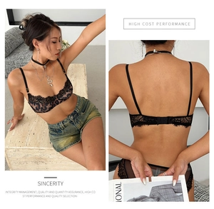 Detail view of leopard print lace bra set showing the eyelash trim and back clasp structure
