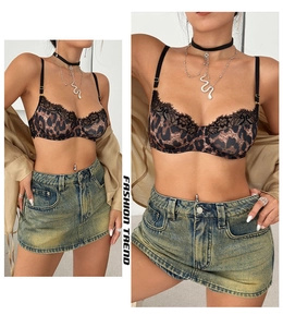 Detailed close-up of leopard print bra with delicate black eyelash lace and steel wire