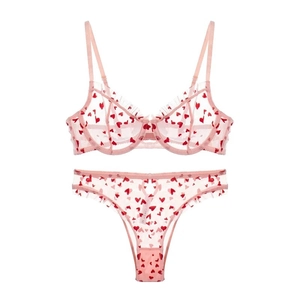 Pink sheer mesh lingerie set with red heart print and ruffled trim detailing