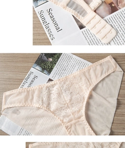 Detailansicht eines rosa Spitzenunterwäsche-Sets mit floralem Muster und Dreier-Hakenverschluss