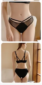Detailed back view of black lace lingerie set with strappy cutout design for women