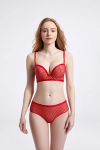 Detail of red mesh lingerie set featuring diamond texture and delicate bow decoration