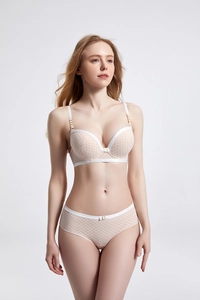 Detail view of pink lingerie set with white diamond mesh and contrasting trim lace