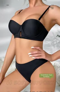 Close-up of seamless black push-up bra and high-cut panties in smooth elastic fabric