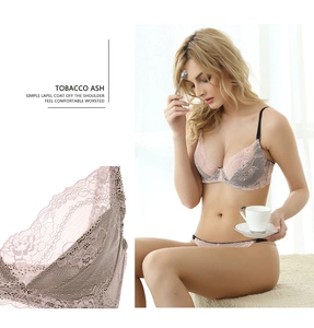 Detail view of pink floral lace lingerie set with grey trim and wave-edge embroidery