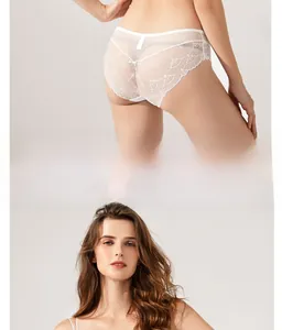 Detail of white sheer lace lingerie set showing back clasp and floral patchwork