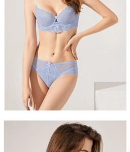 Detail of light blue floral lace lingerie set with elegant pink bow and delicate embroidery