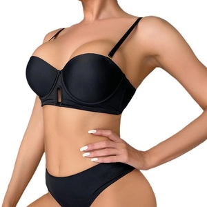 Seamless black push-up lingerie set with smooth cups and hollow striped detail