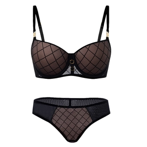 Detail view of black mesh lace lingerie set with diamond pattern and gold hardware