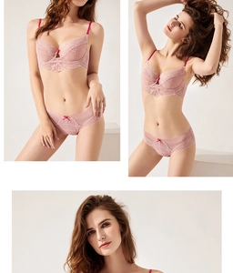 Detail shot of delicate floral lace embroidery on pink bra and matching panties set