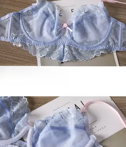 Detail of light blue floral lace bra with pink bow and steel underwire support