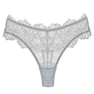 Detailed close-up of light blue floral lace thong with delicate scalloped edges